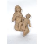 A fantastic hand carved wooden carving desk end of a mother and child moulded in a seated position