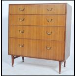 A vintage 20th century Danish influence retro teak 2 over 3 chest of drawers raised on ebonised