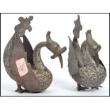 A pair of 20th century Indian brass roupese cast fantastical creatures heavily detailed with