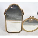 A good 20th century ebonised and gilt wood wall overmantel mirror together with another gilt