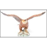 A Beswick - large early bird figure ' Bald Eagle ' Model 1018, of an eagle with it's wings at full