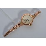 A 9ct gold vintage Longines wrist watch set to an expanding 9ct gold bracelet, Total weight 20.6