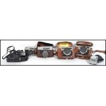 A collection of 5 vintage 20th century Japanese SLR camera's to include Mamiya, Yashika, Konica,