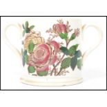 A 19th century Victorian transfer and hand painted twin handled loving cup with 1 Quart notation and