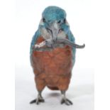 A cold painted bronze pin cushion in the form of a kingfisher with fish in mouth signed to the