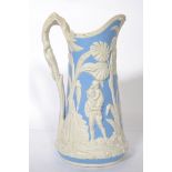 A 19th century Dale Hall Longport ceramic ewer jug having a white and blue ground moulded in