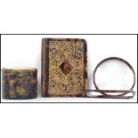 A group of tortoise shell wares to include an aid de memoir with gilt detailing, a hair clip and