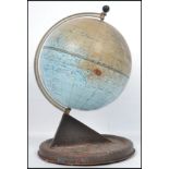 A mid 20th century desk top tin globe by Chad Valley having a sundial base. Measures: 28cm high x