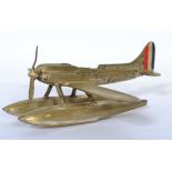 A vintage 20th century brass table lighter in the form of a floating sea areoplane, possibly of a