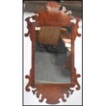 A 19th century mahogany pier mirror / Swansea mirror having a central mirror panel housed in an open