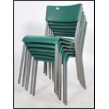 A set of six vintage 20th century tubular metal and vinyl stacking chairs in the manner of James