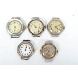 A collection of 5 silver early 20th century wrist watch movements and cases. To include silvered