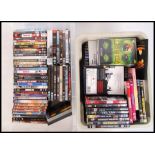 A large collection of assorted DVD's (x2 crates). Many 'cult' related, and some music interest. To