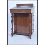 A late Victorian / Edwardian mahogany davenport being line inlaid with tooled leather desk top