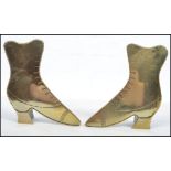 A pair of 20th century brass novelty firesides in the form of Victorian boots. Measures: 10cm high x