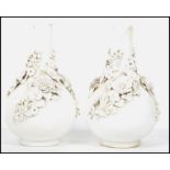 A pair of possible 19th century Stevenson and Hancock Derby Blanc de Chine vases, encrusted with