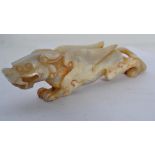 An Oriental jade dragon carving, hand carved with raised wings and open jaw. Weighs 248 grams.