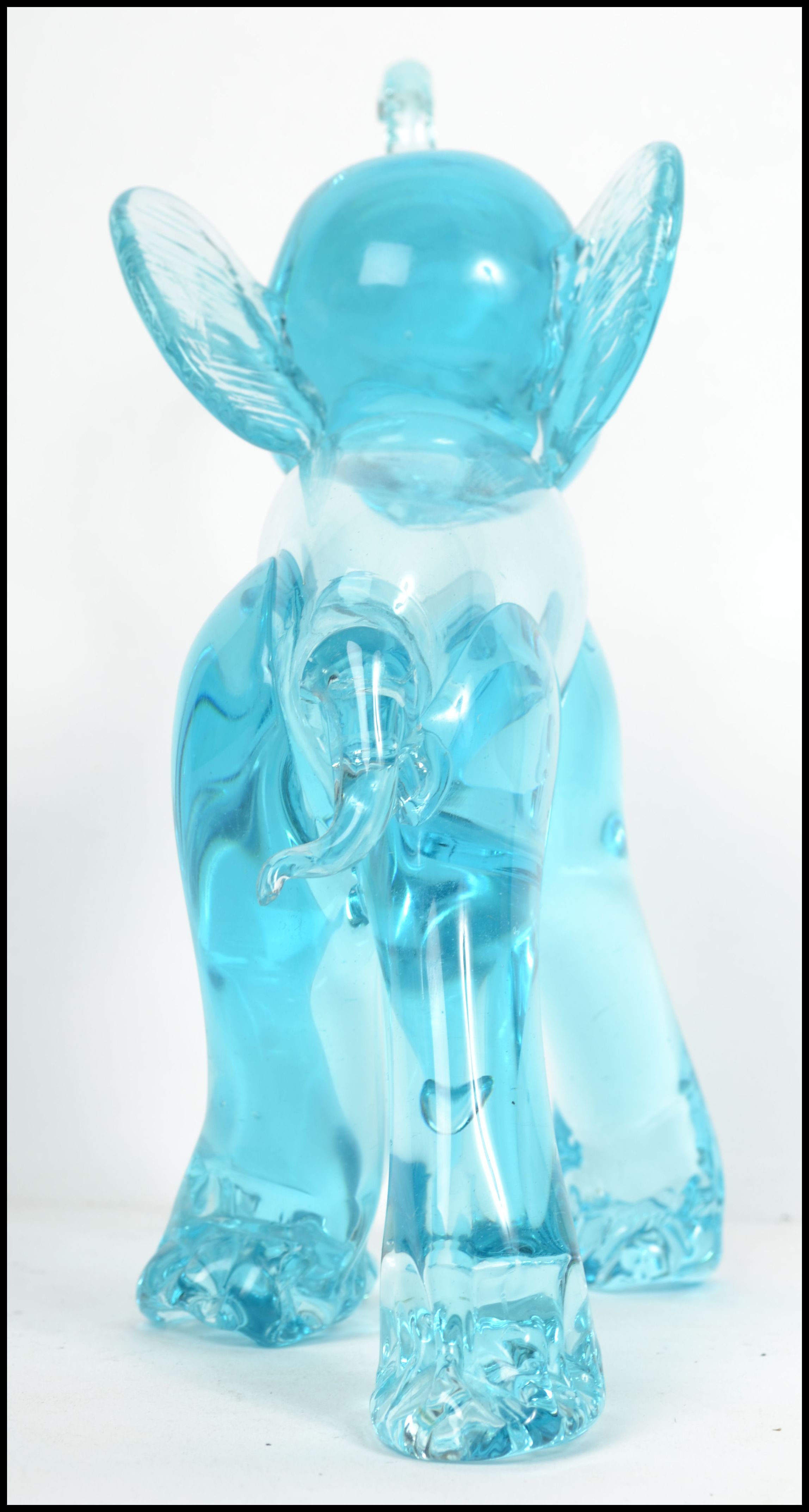 An unusual 20th century / 1960's retro glass elephant figurine. Blue glass with colourful eyes and - Image 4 of 4