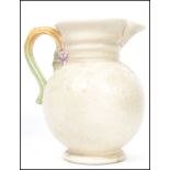 A Clarice Cliff large early 20th century jug with floral vine and spray handle in the ' My