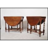 A pair of 20th century Oak drop leaf oval topped barley twist gate legged dinning tables.