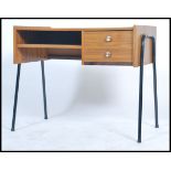 A 1970's unusual teak effect and tubular metal desk issued for the MOD having open recess with