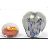 Two large heavy Victorian 19th century end of day glass paperweight dumps, one possibly Nailsea