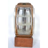 A retro 20th century shop advertising point of sale illuminated revolving octagonal display cabinet,