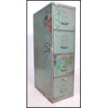 A vintage retro 20th century four drawer industrial filing cabinet retaining original distressed