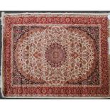 A large North Western Iranian / Persian Heriz carpet - rug having red and beige ground with