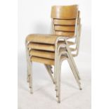 A set of four vintage mid 20th century metal tubular stacking chairs, vinyl seat pads and back