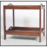 A Georgian revival mahogany two tray / twin tier butlers serving trolley stand. Each tray with