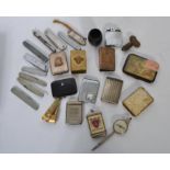 A good collection of vintage 20th century lighters, penknives and vesta cases.