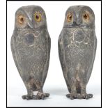 A pair of 19th century Victorian novelty condiments in the form of owls having glass eyes with twist