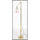 A vintage 20th century metamorphic adjustable floor lamp,  adjustable upper arm with fitted ball