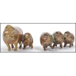 A group of 19th century Victorian brass lead filled novelty pigs paperweights, one joined pair and