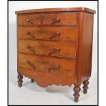 A good Victorian mahogany bow front chest of drawers being raised on turned legs with shaped apron