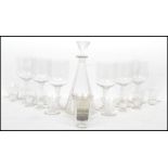 An early 20th century Art Deco French faceted glass decanter of tapering form with an inverse