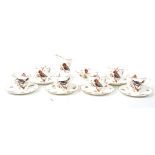 A 1920's Royal Doulton ceramic coffee service consisting of cups saucers, creamer jug and sugar bowl