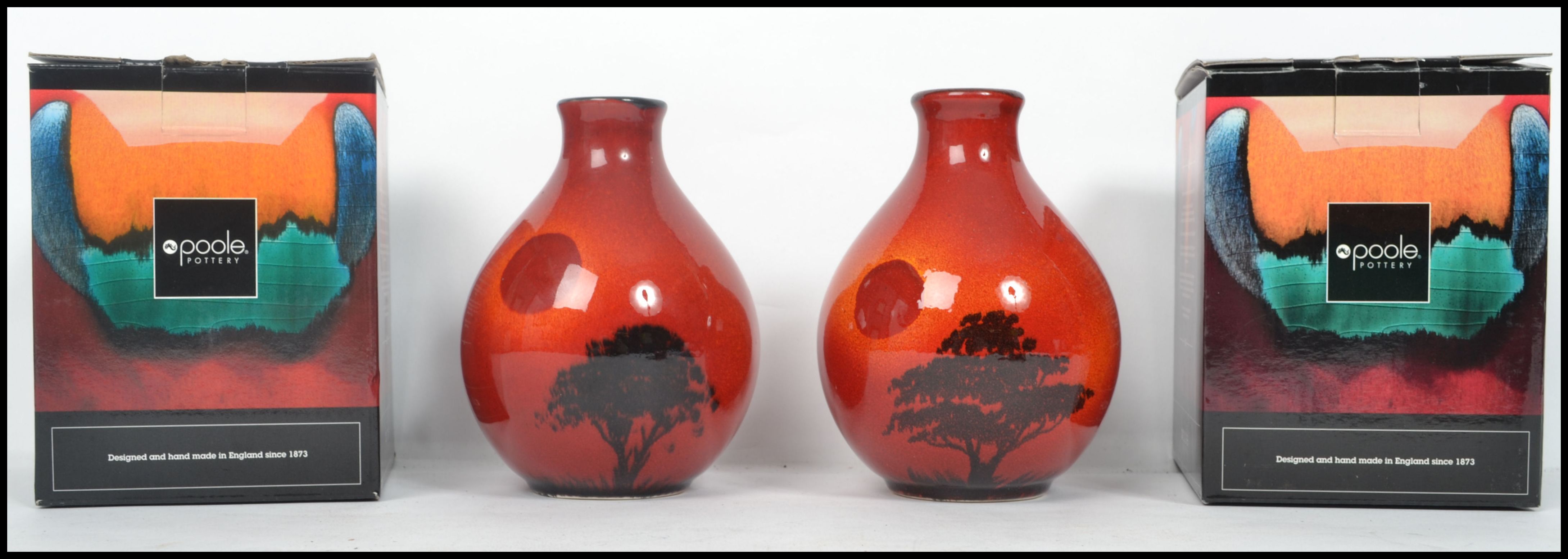 A pair of matching Poole Pottery dump stem vases in the African Sky pattern, both in original