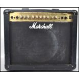 A vintage Marshall music amp - amplifier MG Series 30DFX in black case with handle atop over dials