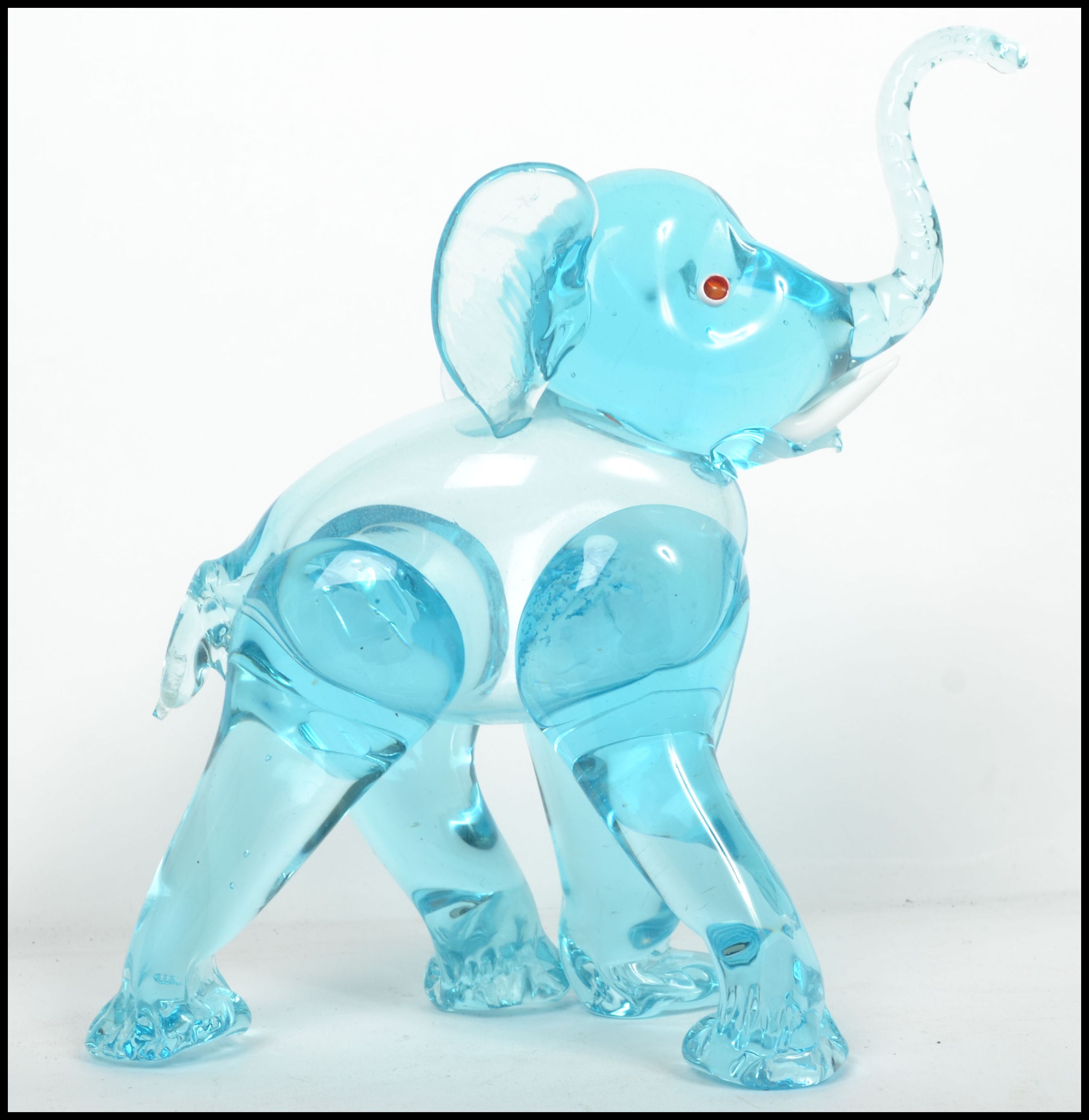 An unusual 20th century / 1960's retro glass elephant figurine. Blue glass with colourful eyes and - Image 3 of 4