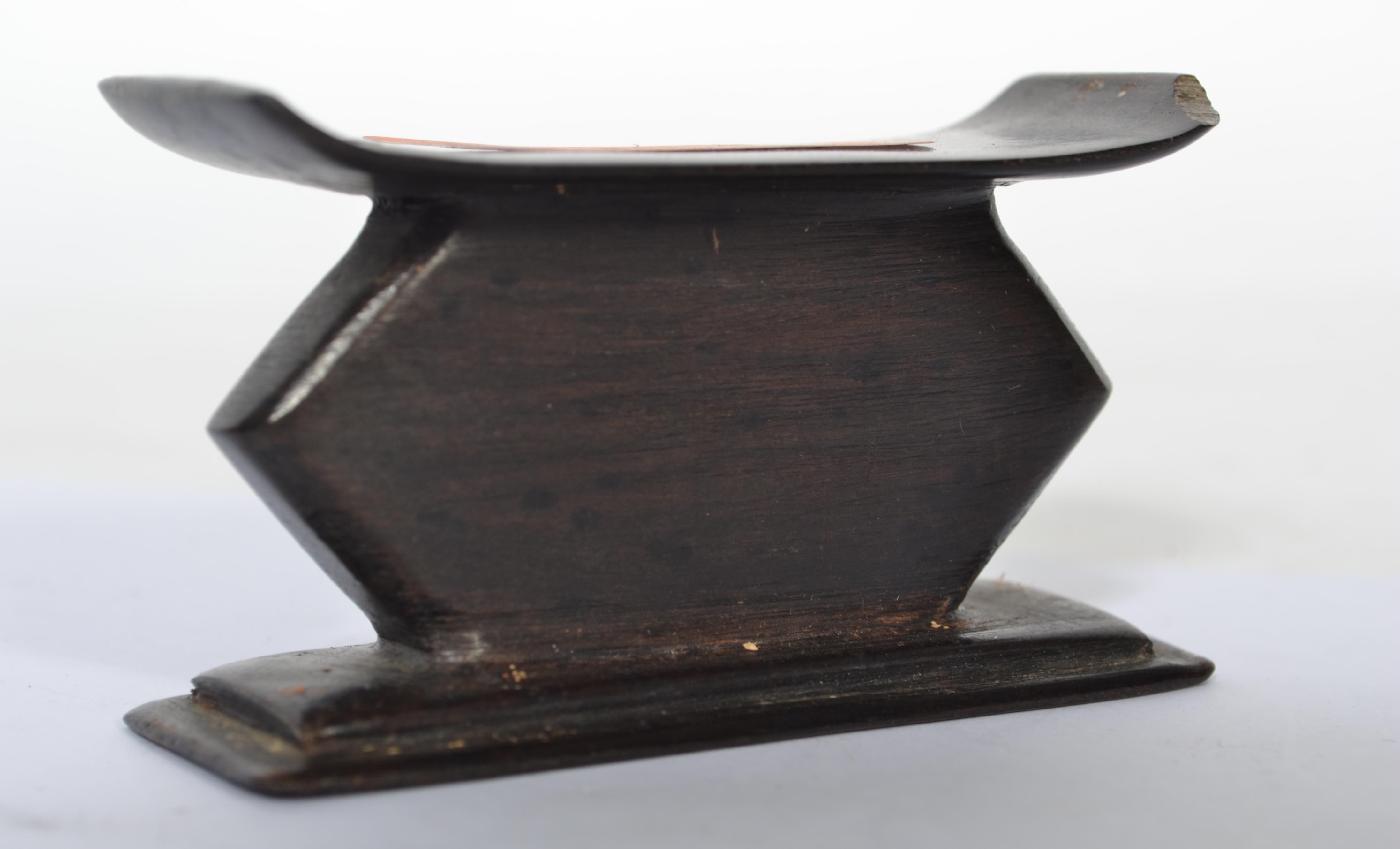 A 20th century hardwood miniature ashanti stool -