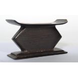 A 20th century hardwood miniature ashanti stool -
