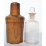 A 19th century glass medicine bottle with square c