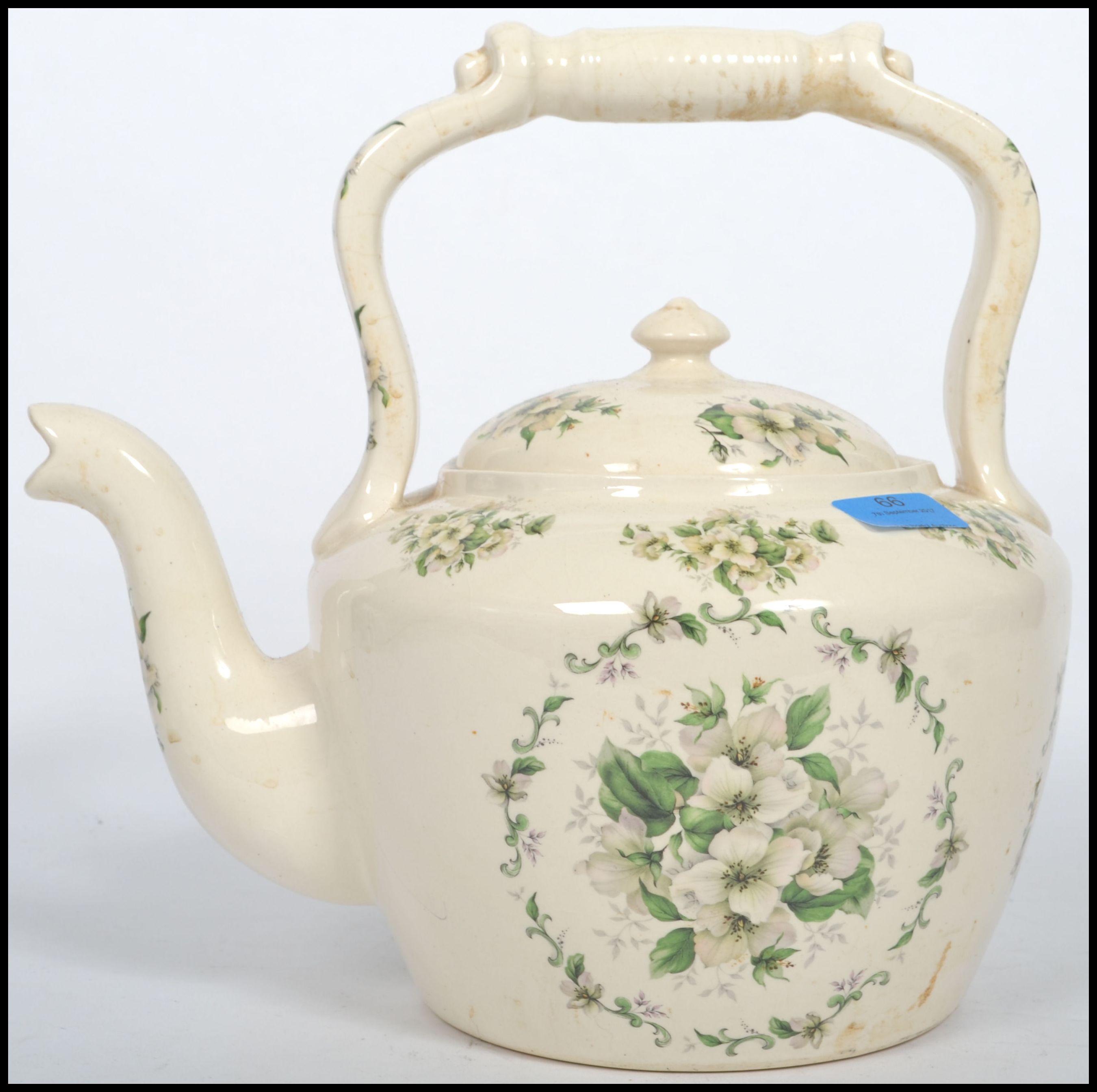 A large 20th century ceramic cream glaze cauldron