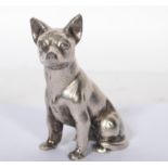 A silver plated bronze figurine of a dog modelled