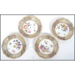 A group of four 19th century ribbon plates having hand painted floral sprays, each plate having a