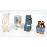 A collection of 19th century jugs to include an unusual blue glaze vase with parrot decoration