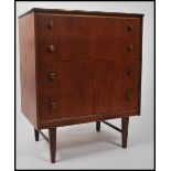 A good Danish influenced 1970's retro teak chest of drawers being raised on tapering legs with an