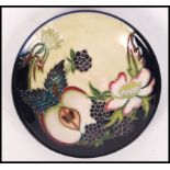 A Moorcroft Trial Piece ceramic tube lined pin dish coaster decorated in the Apple and Blackberry